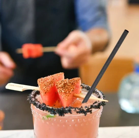 Cocktail served with an agave straw